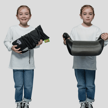 A composite image of a young girl standing against a plain background. On the left, she is smiling and holding the BubbleBum booster seat compactly rolled up in its black travel bag. On the right, she holds the same booster seat fully inflated and ready for use, showing its mesh seating surface and armrests.