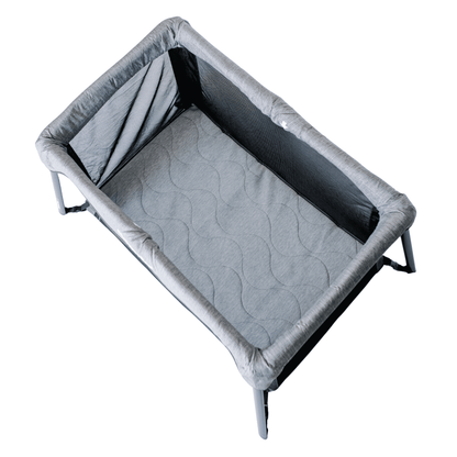 Gray pet bed with a textured surface on a white background