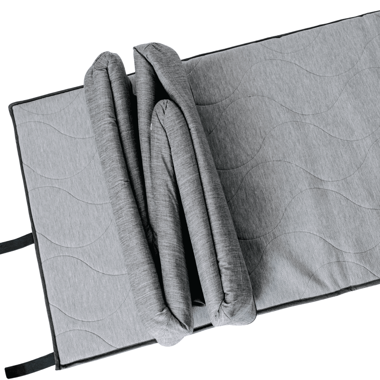 Gray quilted mat with a folded blanket on a white background