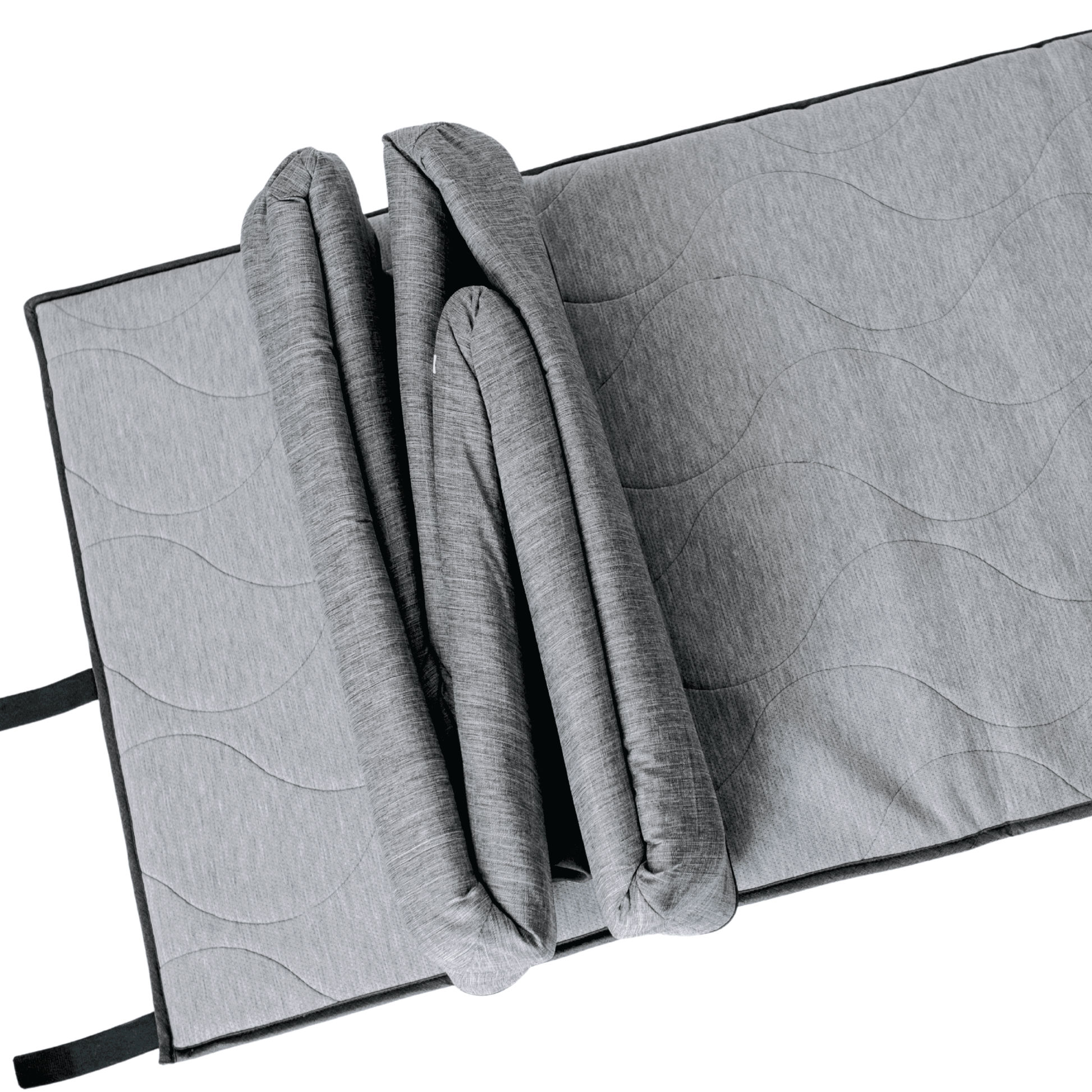 Gray quilted mat with a folded blanket on a white background