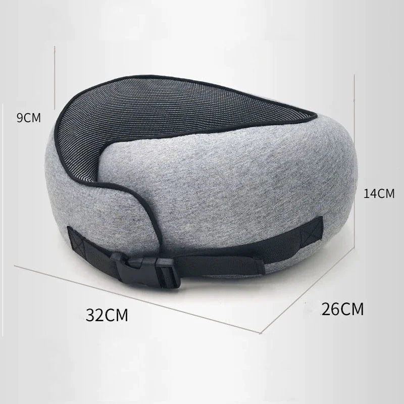 Gray ergonomic neck pillow with a buckle strap, featuring dimensions of 32cm by 26cm.